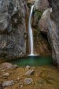 Waterfall on a green pond. Cadi, Spain.