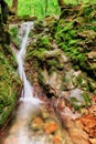 Waterfall with green stones