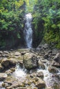 Waterfall with Green Vegetation and Rocks in Maui, Hawaii. Royalty Free Stock Photo