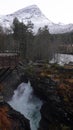 Waterfall of Gudbrandsjuvet gorge in Valldola valley on Trollstigen route in snow in Norway Royalty Free Stock Photo