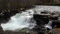 Waterfall of Gudbrandsjuvet gorge in Valldola valley on Trollstigen route in snow in Norway Royalty Free Stock Photo