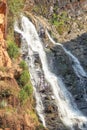 Waterfall gushing down a mountainside Royalty Free Stock Photo