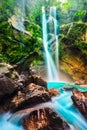 Waterfall hidden in the tropical jungle Royalty Free Stock Photo