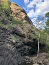 Waterfall. Huge gray boulders in the forest