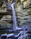 Waterfall of iced water, cold and frozen rocks. Long photo exposure Royalty Free Stock Photo