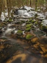 Waterfall on Jezerni creek in spring in national park Sumava in Czech republic Royalty Free Stock Photo