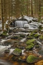 Waterfall on Jezerni creek in spring in national park Sumava in Czech republic Royalty Free Stock Photo