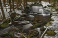 Waterfall on Jezerni creek in spring in national park Sumava in Czech republic Royalty Free Stock Photo