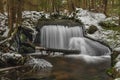 Waterfall on Jezerni creek in spring in national park Sumava in Czech republic Royalty Free Stock Photo