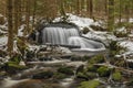 Waterfall on Jezerni creek in spring in national park Sumava in Czech republic Royalty Free Stock Photo