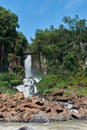 Waterfall in the jungle with rocks in the river with blue sky Royalty Free Stock Photo