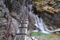 Waterfall with ladder in canyon, sucha bela.Icefall in the gorge of Slovak paradise national park. Royalty Free Stock Photo