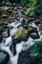 Waterfall located in the forest of Thailand. The water flows over a rocky cliff into a pool. Royalty Free Stock Photo