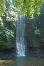A waterfall located in the middle of a forest in the mountains of Cimahi City Royalty Free Stock Photo