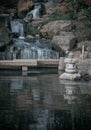 Waterfall long exposure silky smooth waterfall over rocky cliffs in Kyoto garden Royalty Free Stock Photo