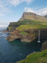 Waterfall MÃºlafossur in GÃ¡sadalur village during a sunny day, VÃ¡gar, Faroe Islands