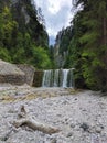 Waterfall on Martuljek river surrounded by forest, Slovenia Royalty Free Stock Photo