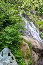 Waterfall and monument of St. Andrew near Sarpi town in Adjara, Georgia