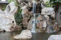 Waterfall motion on a stone in the garden Royalty Free Stock Photo