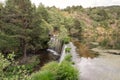 Waterfall in mountain lake and green park in Rascafria. Royalty Free Stock Photo