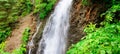 Waterfall on a mountain river. Beautiful natural background. Wide photo Royalty Free Stock Photo