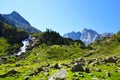 Waterfall with mountain Vignemale, Pyrenees, France. Royalty Free Stock Photo