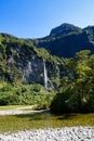Waterfall in mountains of Doubtful Sound National Park - portrait