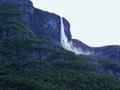 waterfall in mountains, nature Norway, fjord background Royalty Free Stock Photo