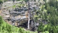 Waterfall in the mountains near lake. Oeschinnensee. Kandertal. Bernese Oberland. Canton Bern.