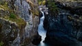 Waterfall in Nairn Falls Provincial Park, Canada, surrounded by rocky mountains and evergreen forest Royalty Free Stock Photo