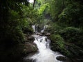 Waterfall in Nan, Thailand. Waterfalls in green rain forest. Stream from waterfall.