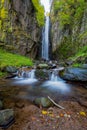 Waterfall in a narrow canyon carved by water, landscape