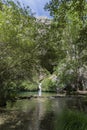 Waterfall and natural pool at Cueva del Gato Spain