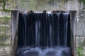 The waterfall out dam of city pond in Bueckeburg, Germany