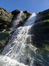 Waterfall over mossy rocks Royalty Free Stock Photo