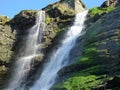 Waterfall over mossy rocks Royalty Free Stock Photo