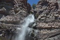 Waterfall over mountain cliff Royalty Free Stock Photo