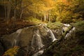 Waterfall over rock in spectacular autumn beech forest on the Gartxot mountain route in Navarra, Spain Royalty Free Stock Photo