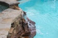 Waterfall Over Rocks From Hot Tub On Higher Level Down To Swimming Pool -Refreshing And Cool On A Summer Day