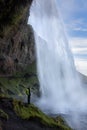 Waterfall person iceland Seljalandsfoss travel Royalty Free Stock Photo