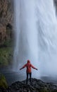 Waterfall person iceland Seljalandsfoss travel Royalty Free Stock Photo