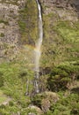 Waterfall and rainbow in Flores island, Azores. Poco do Bacalhau