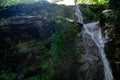 Waterfall from ravine.waterfall from the mountain river. rapid current Royalty Free Stock Photo