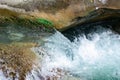 Waterfall from ravine.waterfall from the mountain river. rapid current Royalty Free Stock Photo