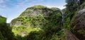 Waterfall Risco with levada in Madeira with green vegetation, Portugal Royalty Free Stock Photo