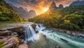 Waterfall and river flow in mountain region at sunrise Royalty Free Stock Photo