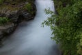 Waterfall between the rocks in Glacier National Park.