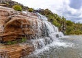 Waterfall among the rocks and vegetation of the Biribiri environmental reserve Royalty Free Stock Photo