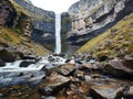 a waterfall in a rocky canyon