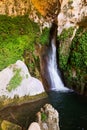 Waterfall in rocky grot Royalty Free Stock Photo